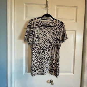 Dressy blouse with a silky feeling.  Not see thru.  Long length.